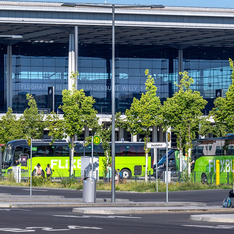 View of long-distance buses, with Terminal 1 behind them.