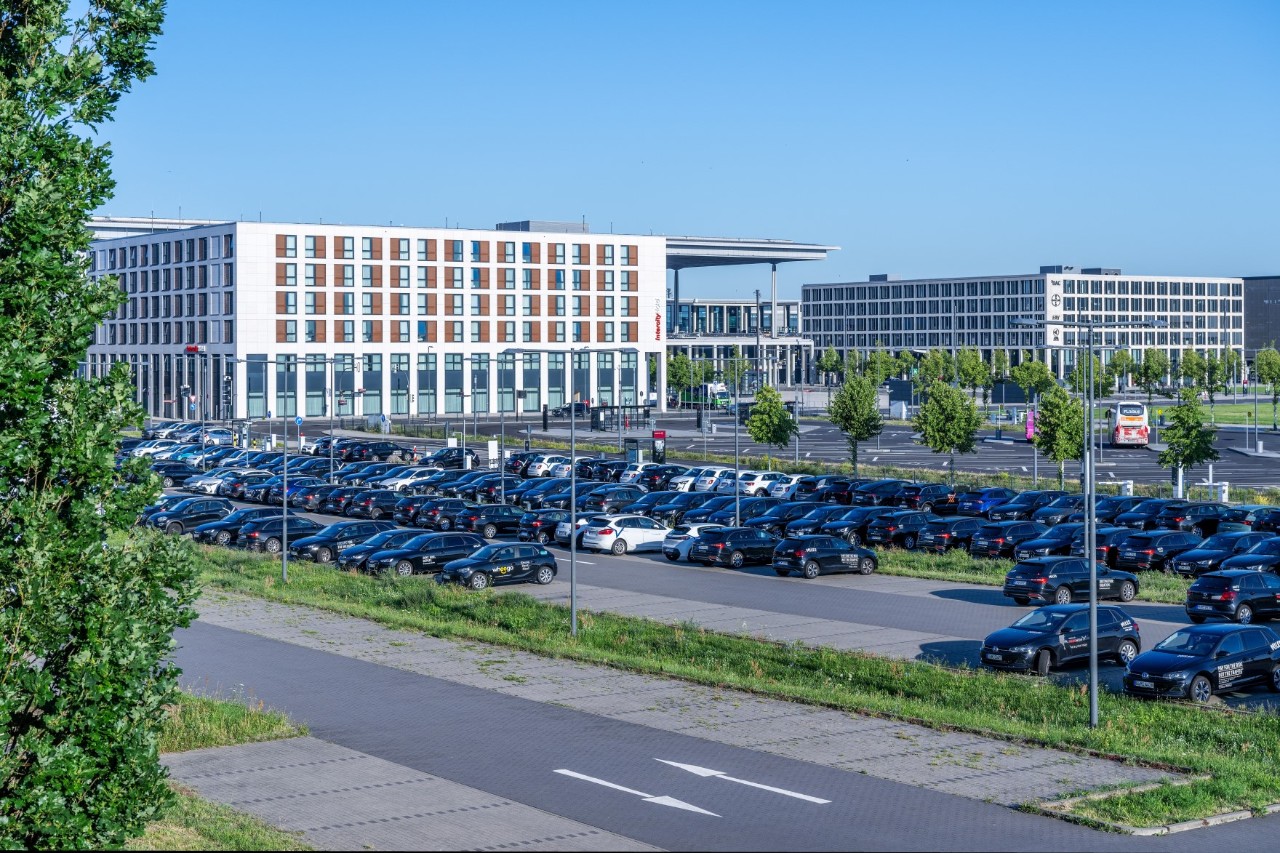Car park P4. Behind it, hotels and Terminal 1.