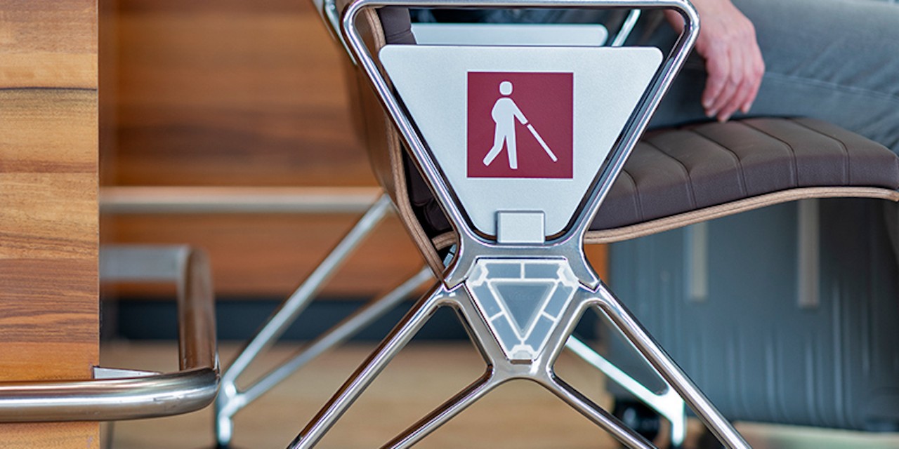 Bench with information for passengers with reduced mobility