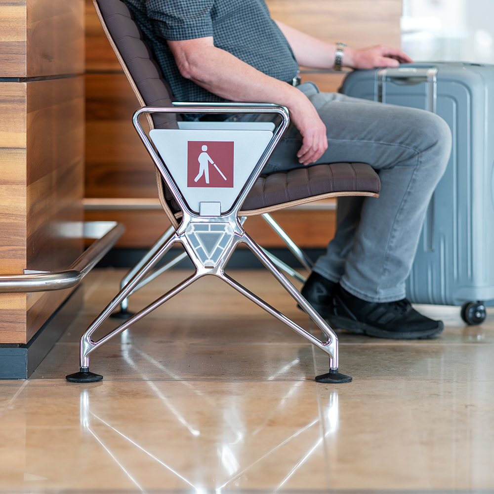 Bench with information for passengers with reduced mobility