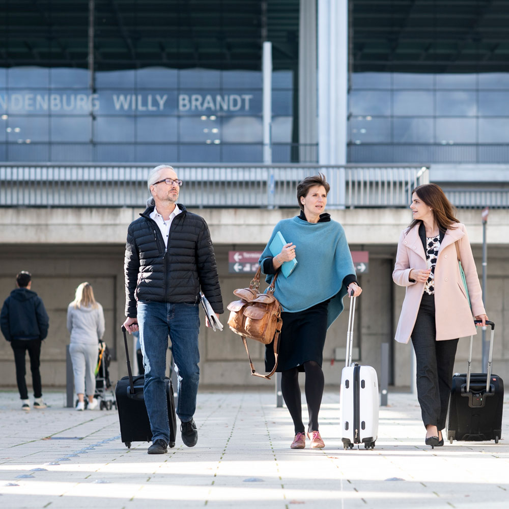 Business travellers at BER Airport