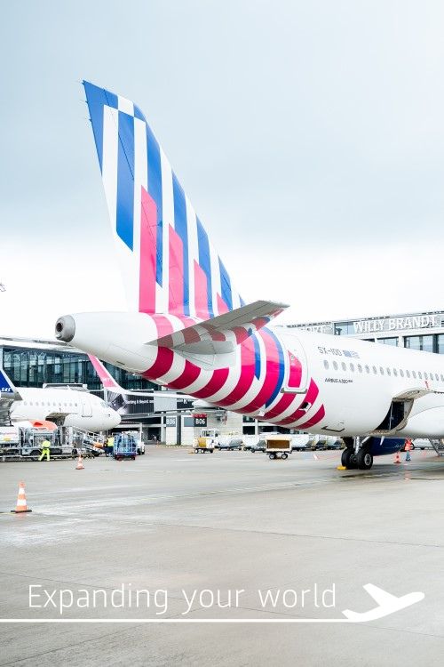 An SKY express airline aircraft at the gate.
