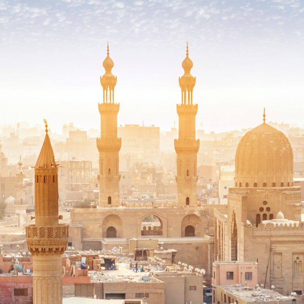 City view of Cairo in the evening sun. Two towers of a mosque.