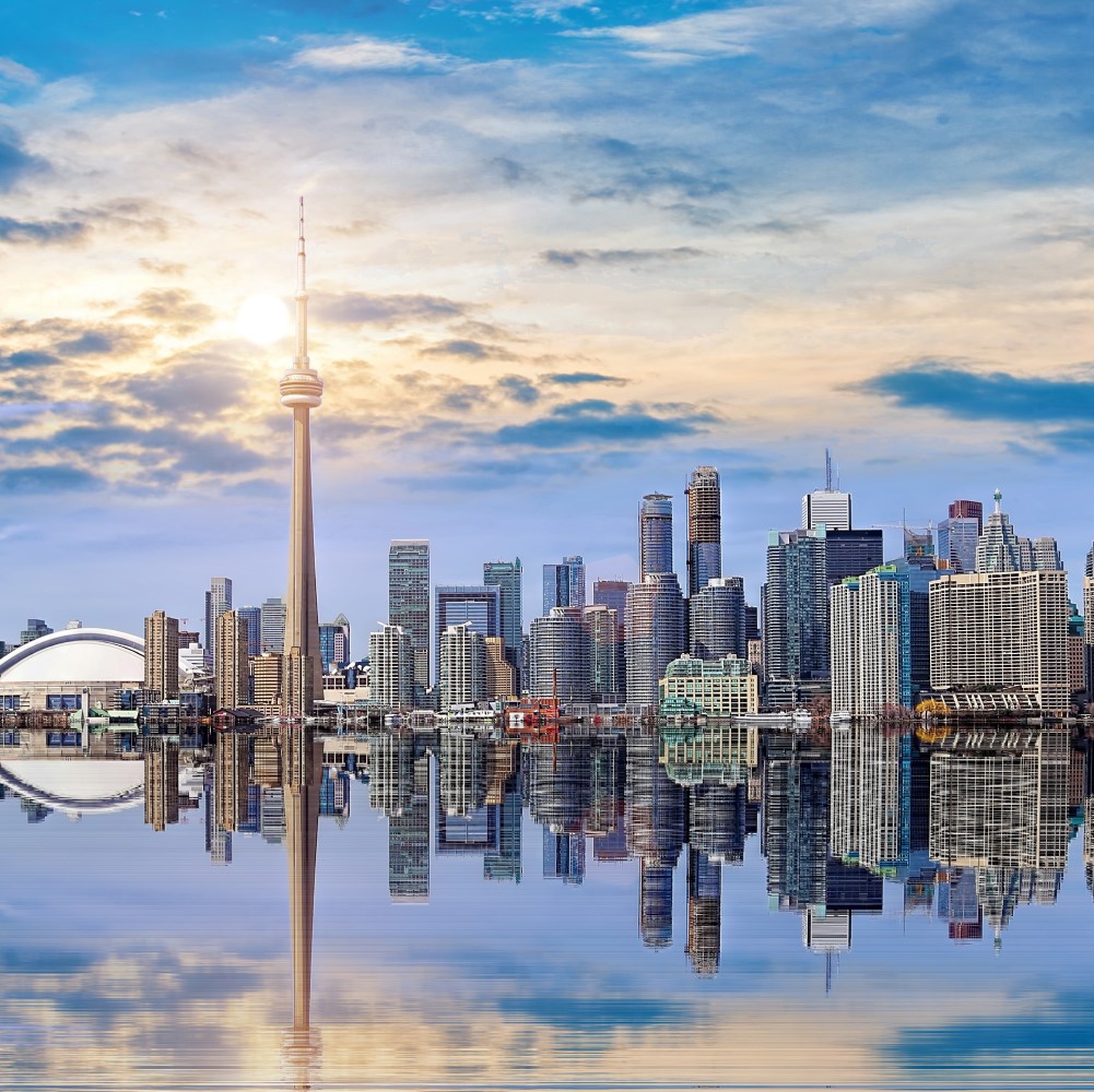 The Toronto skyline with television tower. Water in front.