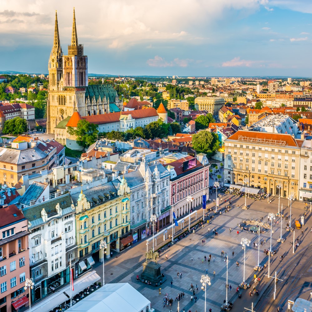View from above of Zagreb’s city centre with elegant buildings, cathedral and a lively square.